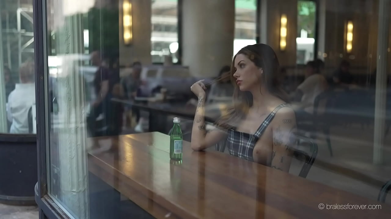 Sara flashing her tits thru the street window