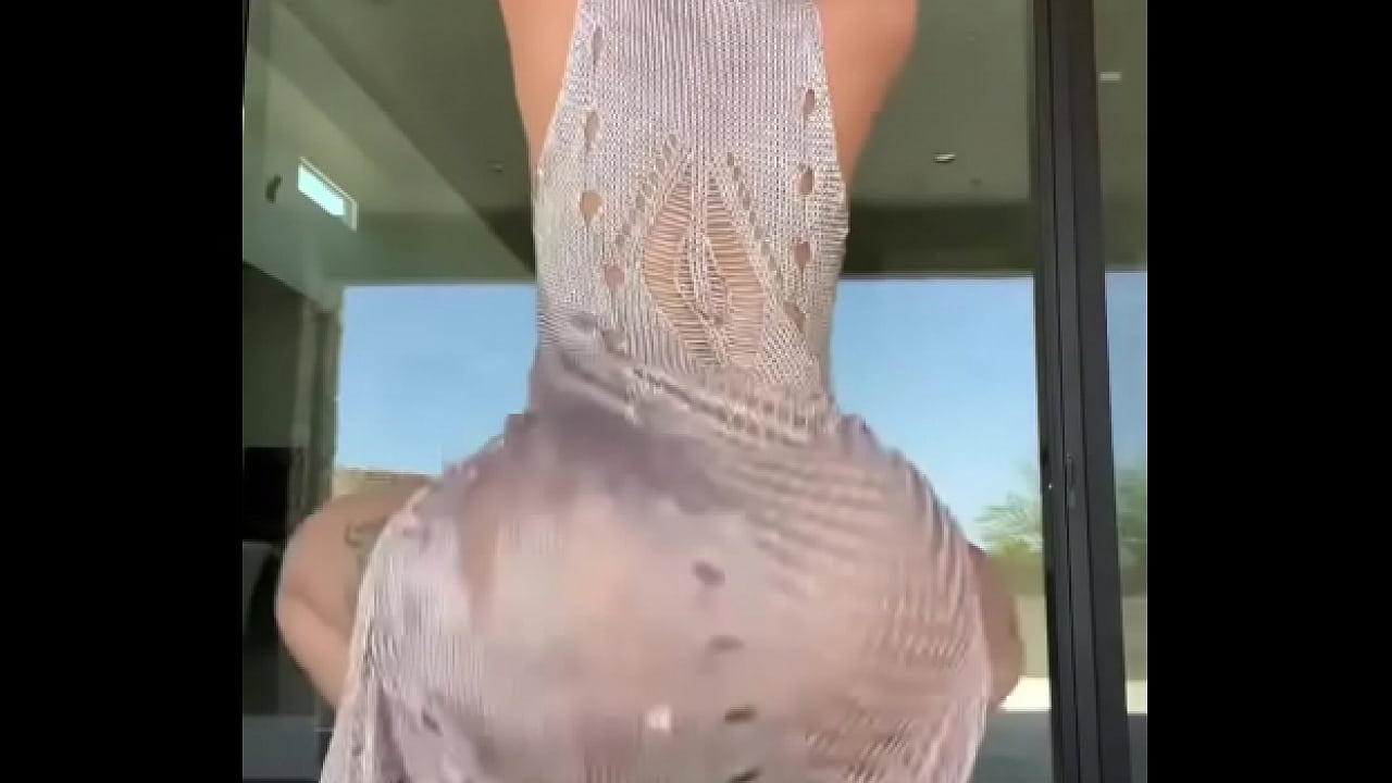 Latina shaking ass in a dress