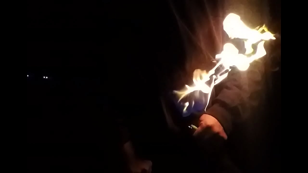 Stroking On Fire at Night