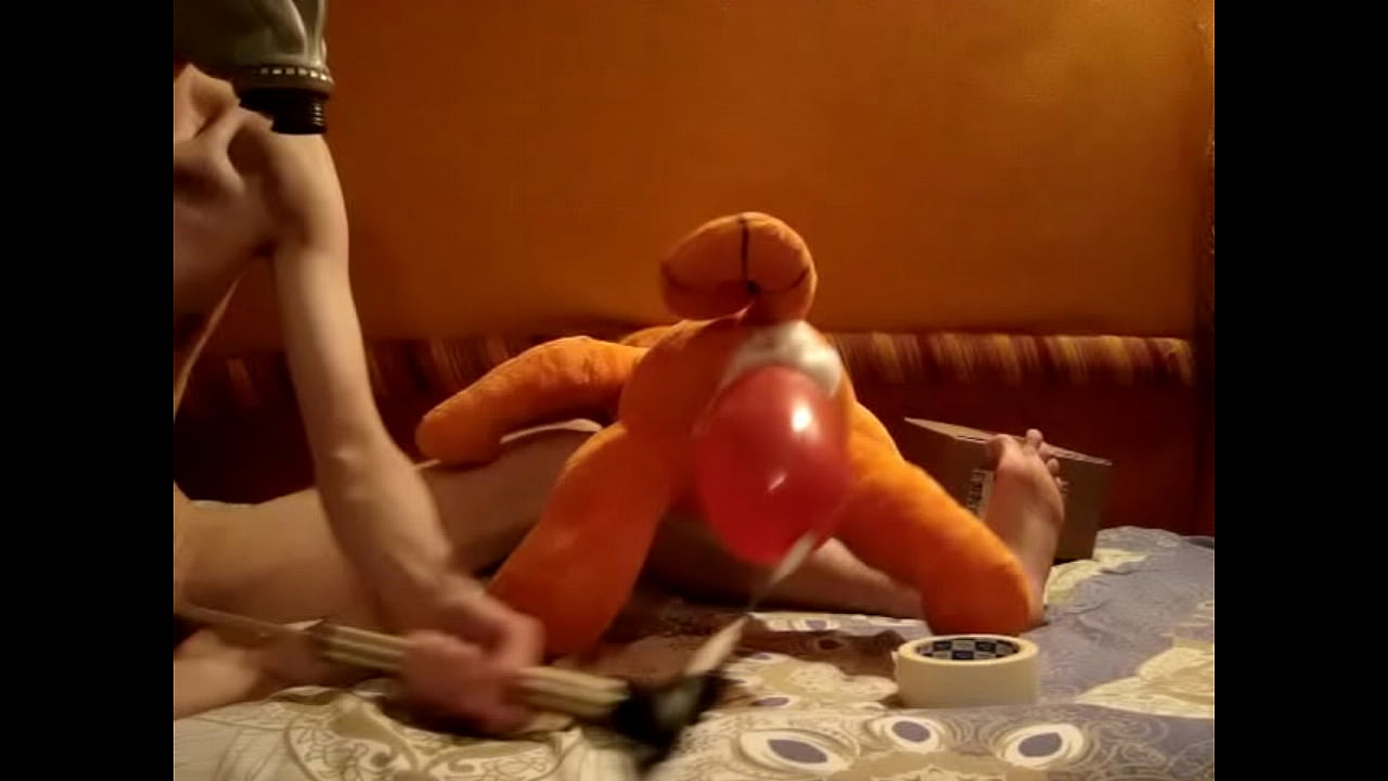 Twink in gas mask inflates his plushie