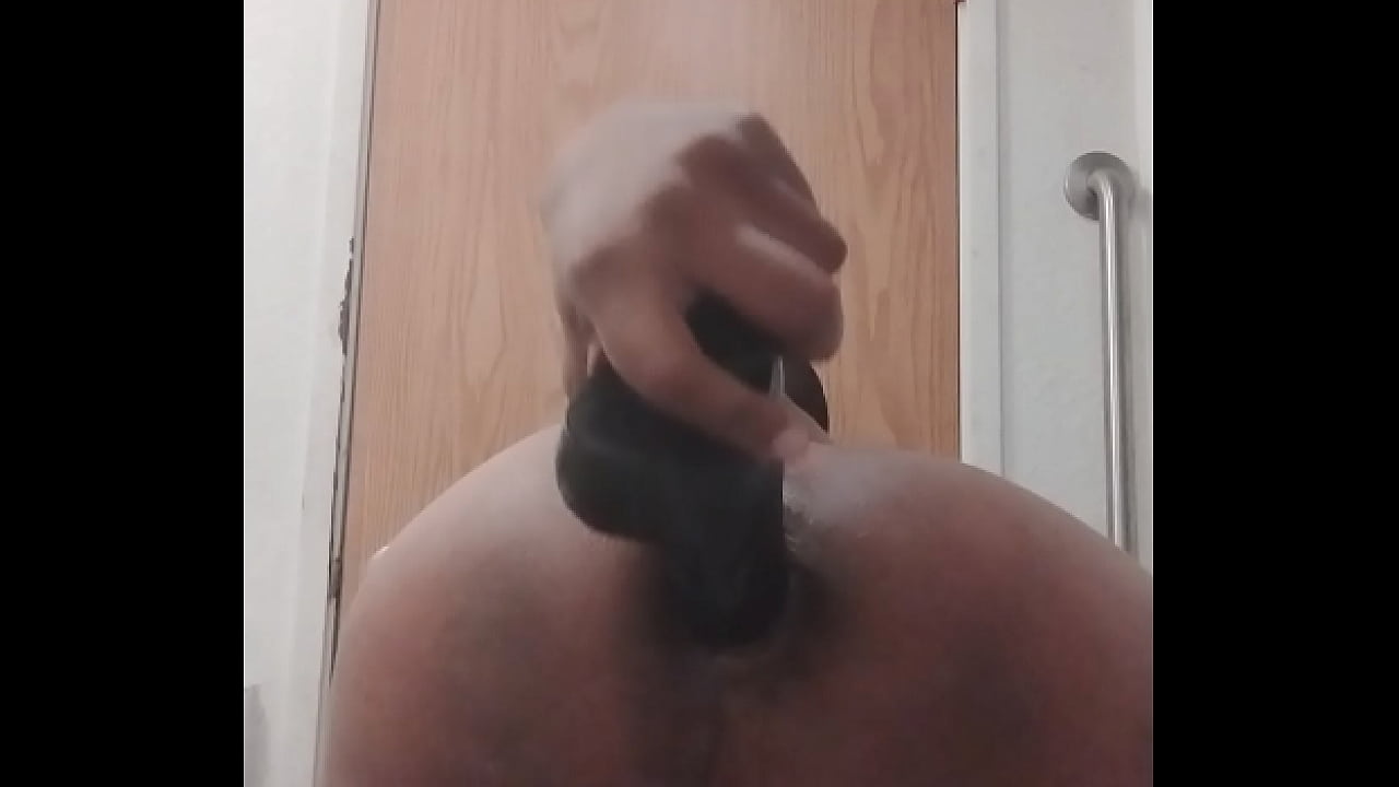 Pushing a dildo in my ass while I get gaped