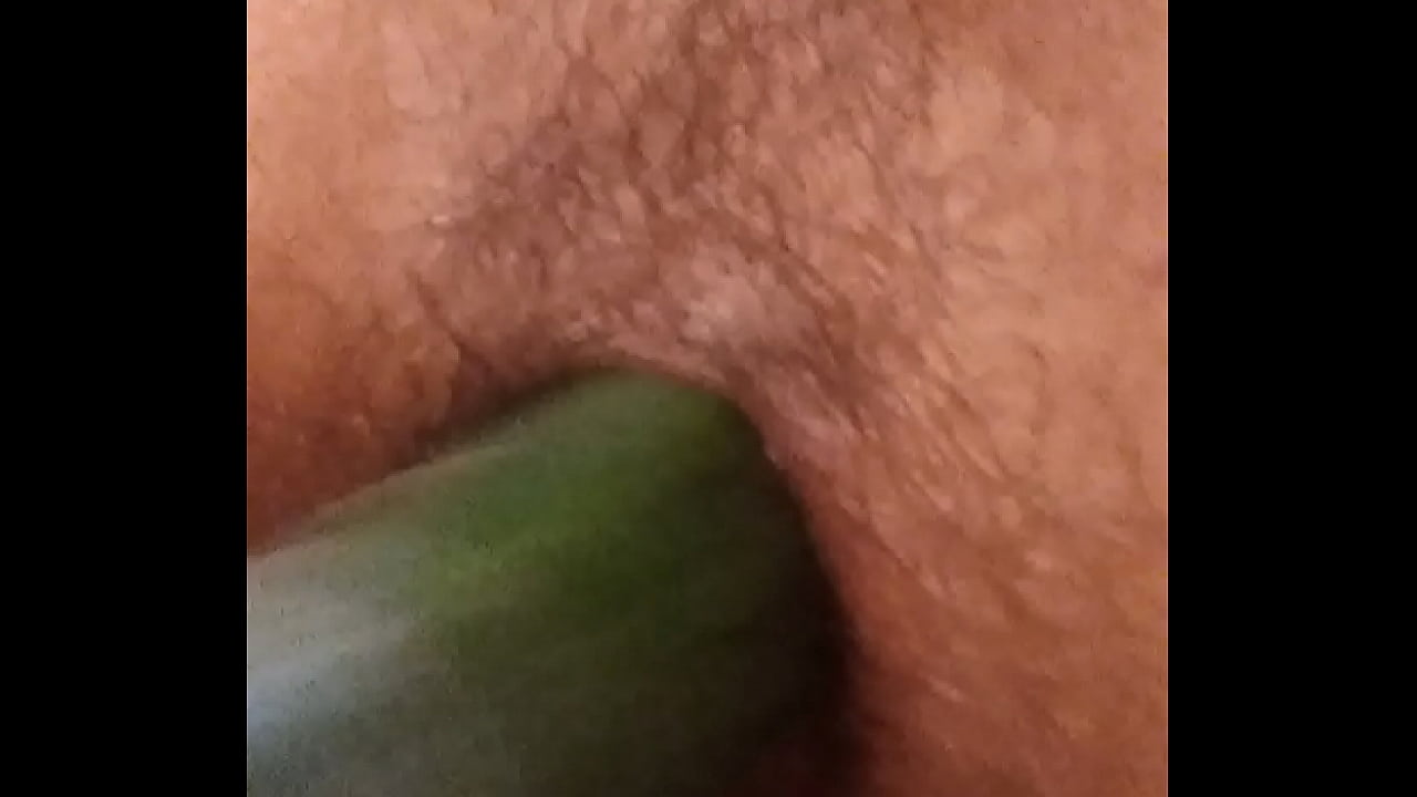 Cucumber on transgender pussy