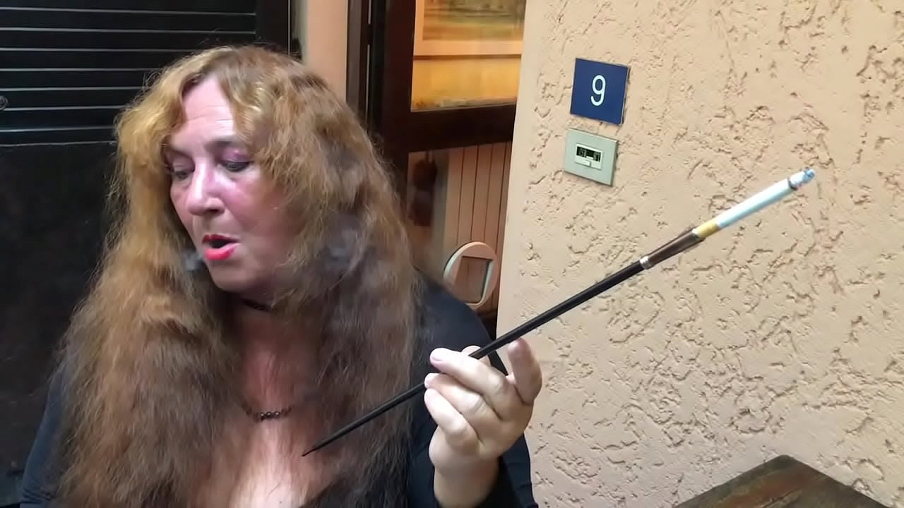 Hot, decadent fetish dom lady smokes with 20" cigarette holder