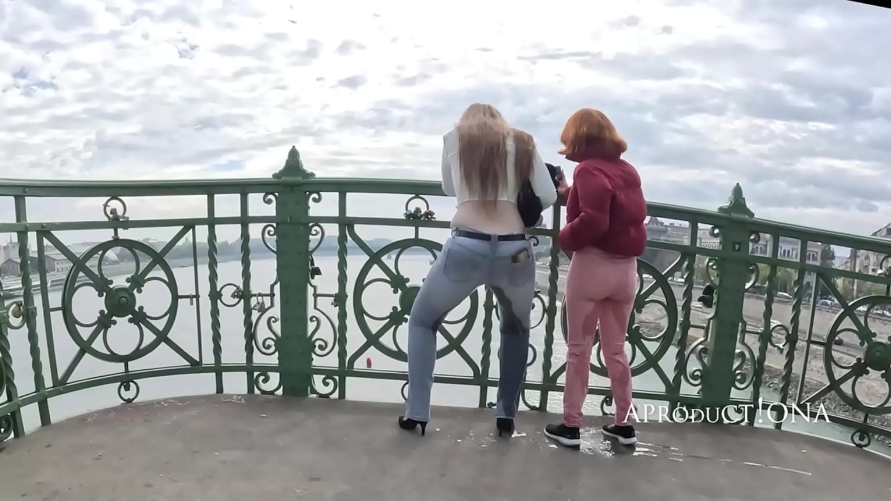 Wetting in their Jeans together on the bridge