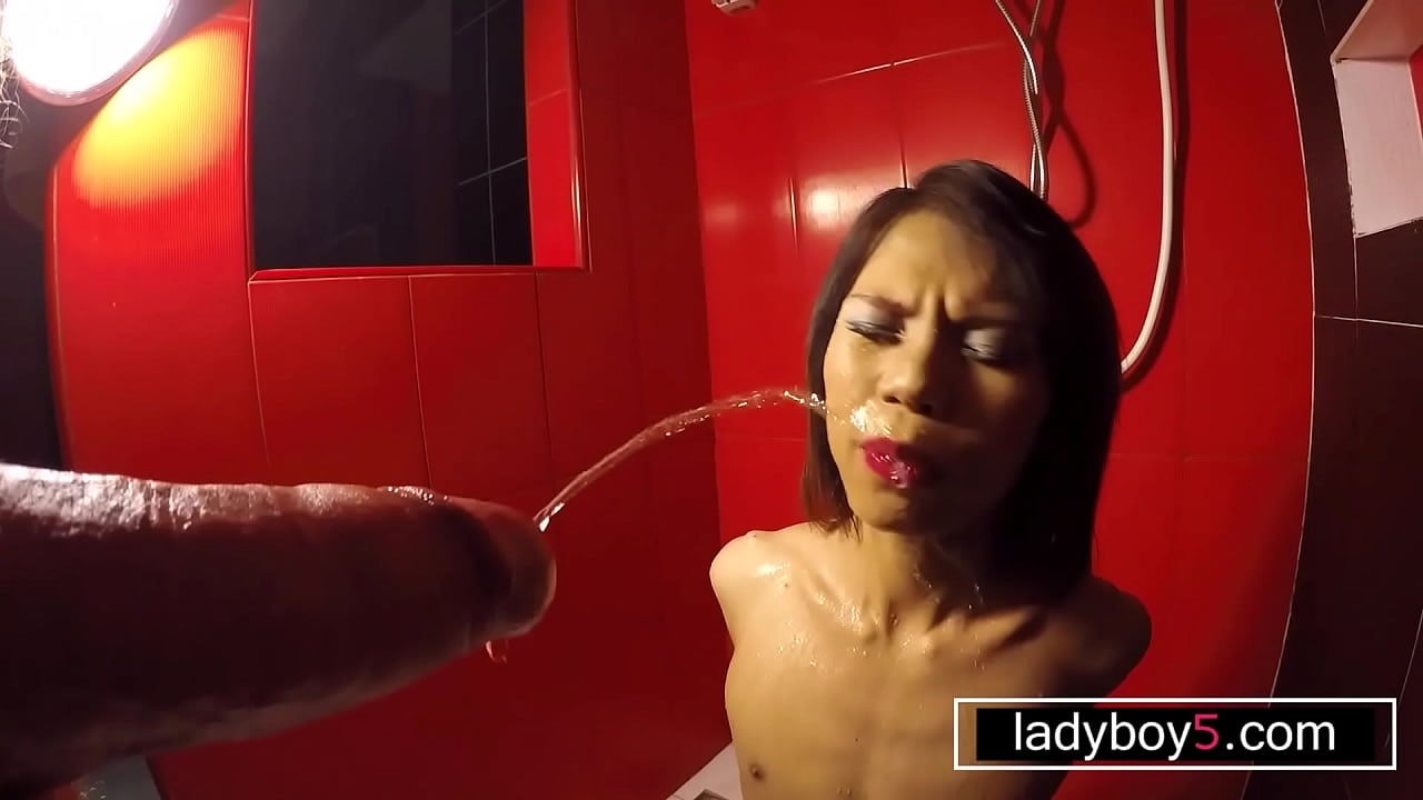 Thai teen shemale in bondage pissed in her mouth and sucking dick