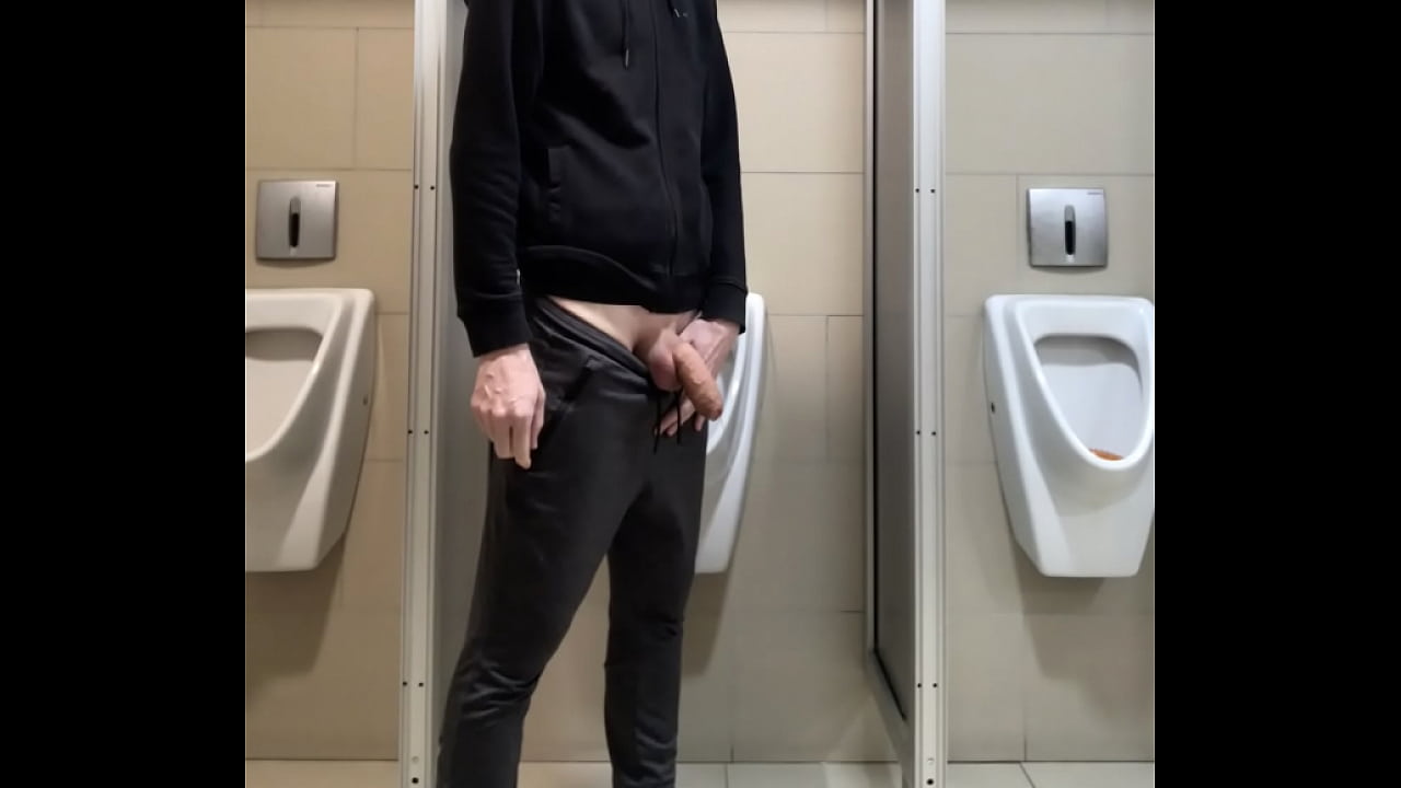 pissing in public toilet of a departmet store with soft dick