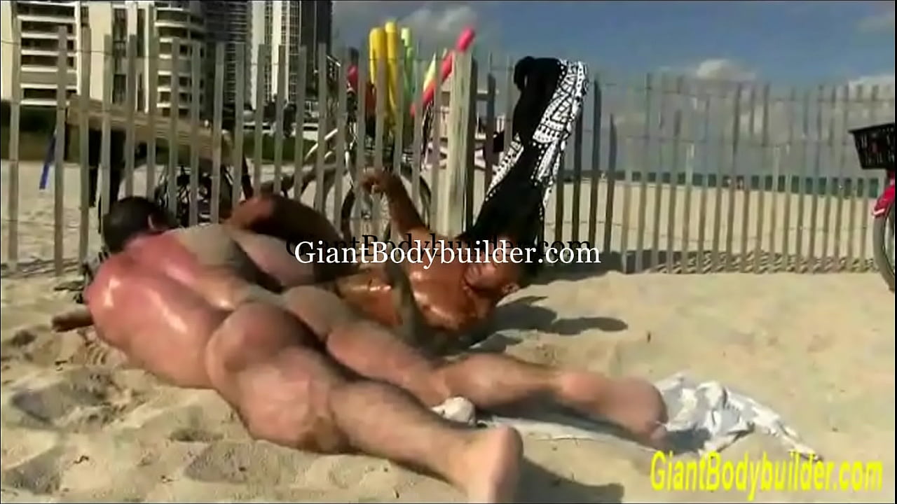 hot muscle men muscle fighting on the beach