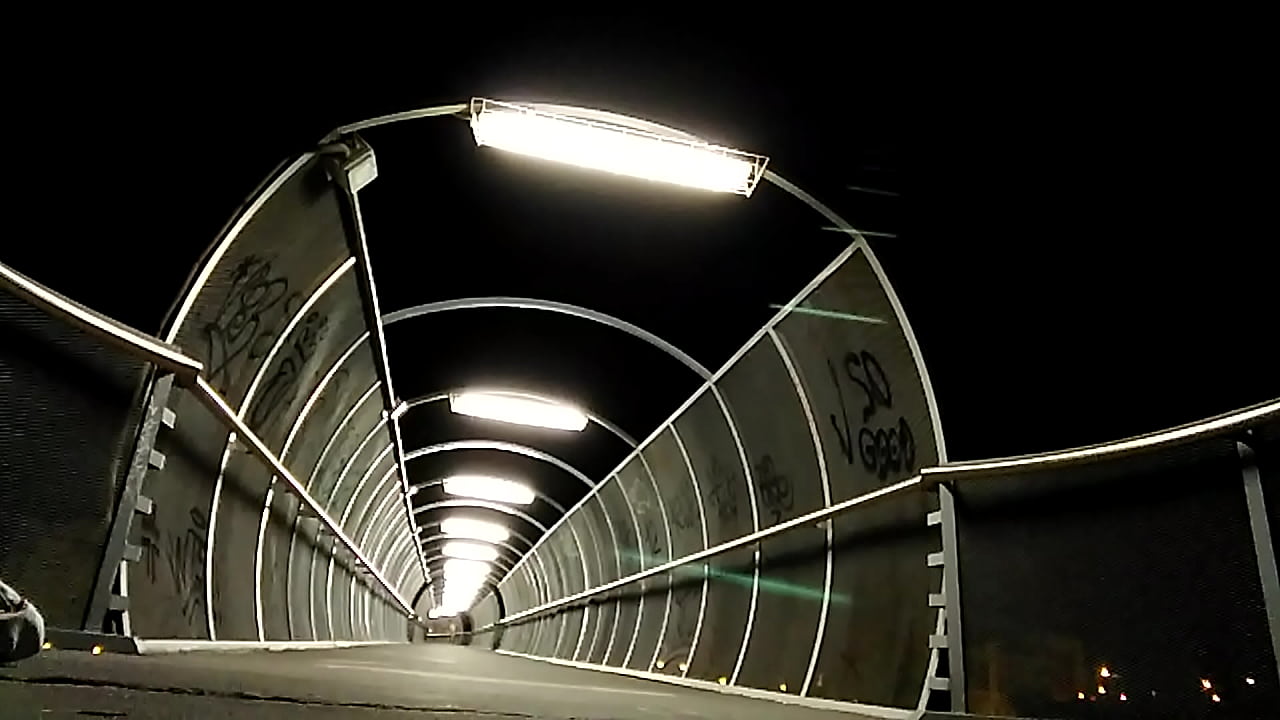 Naked on a lighted bridge