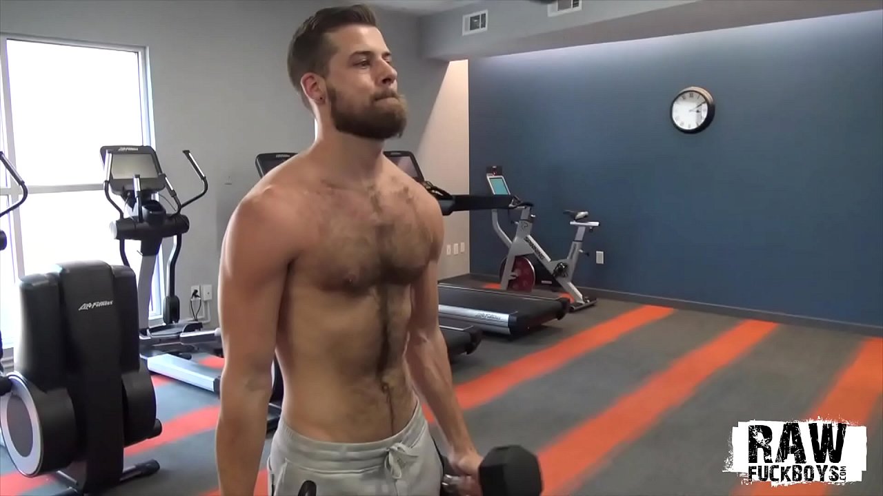 Hairy stud tugs his cock after the gym