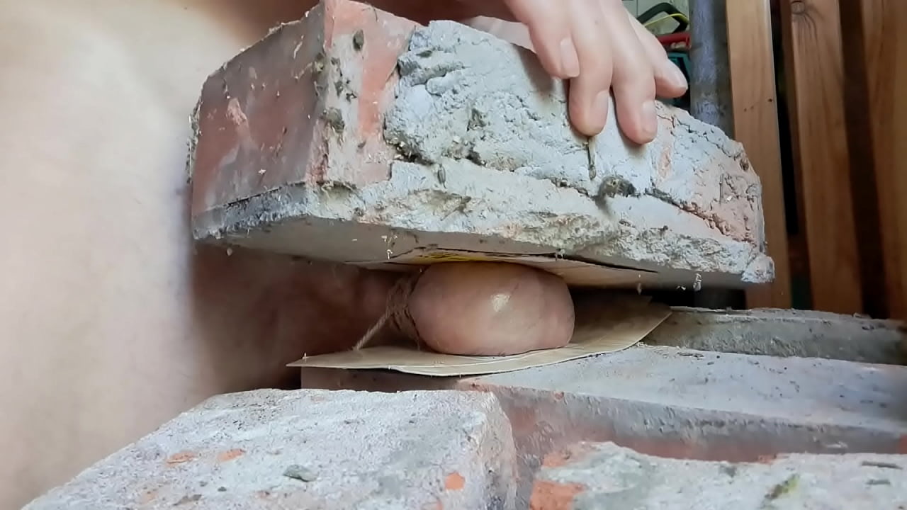 My balls are squeezed between 2 bricks