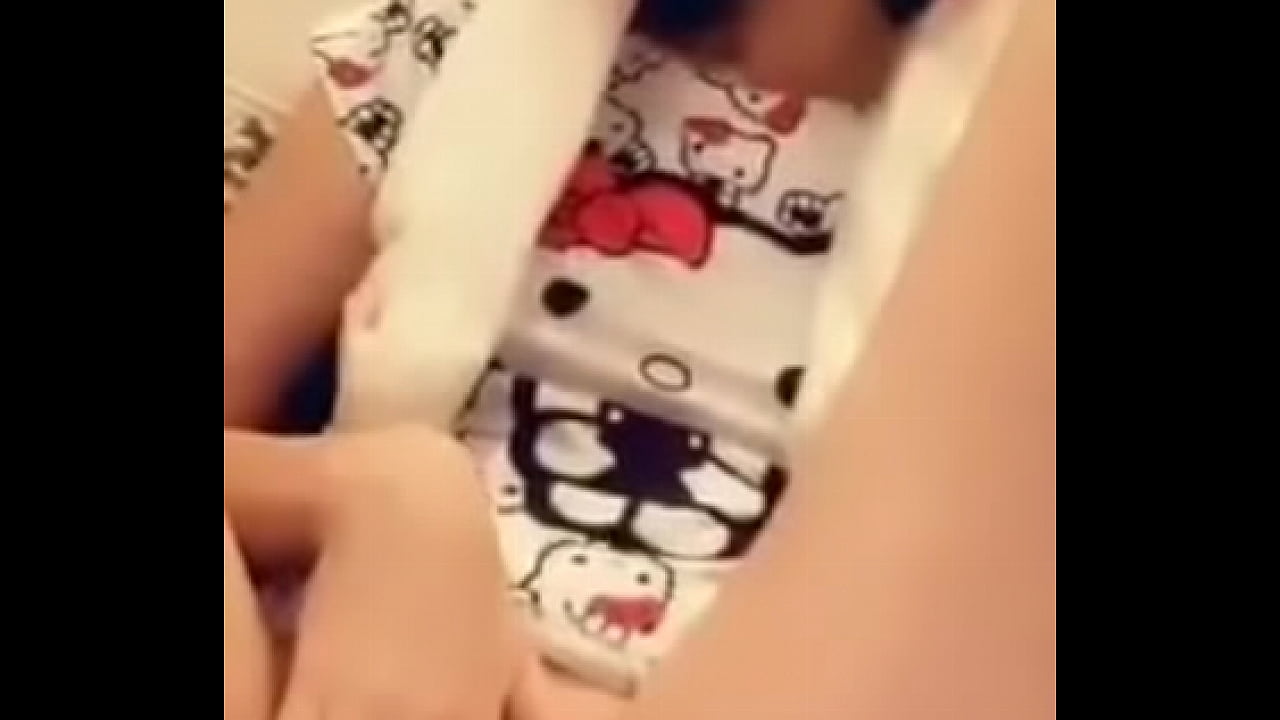 Teen pisses wearing Hello Kitty top and bunny ears hat