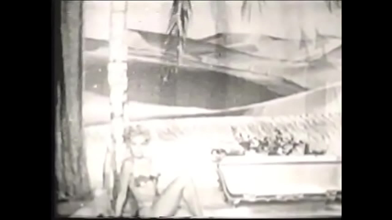 Cute blonde takes a bath in an old movie