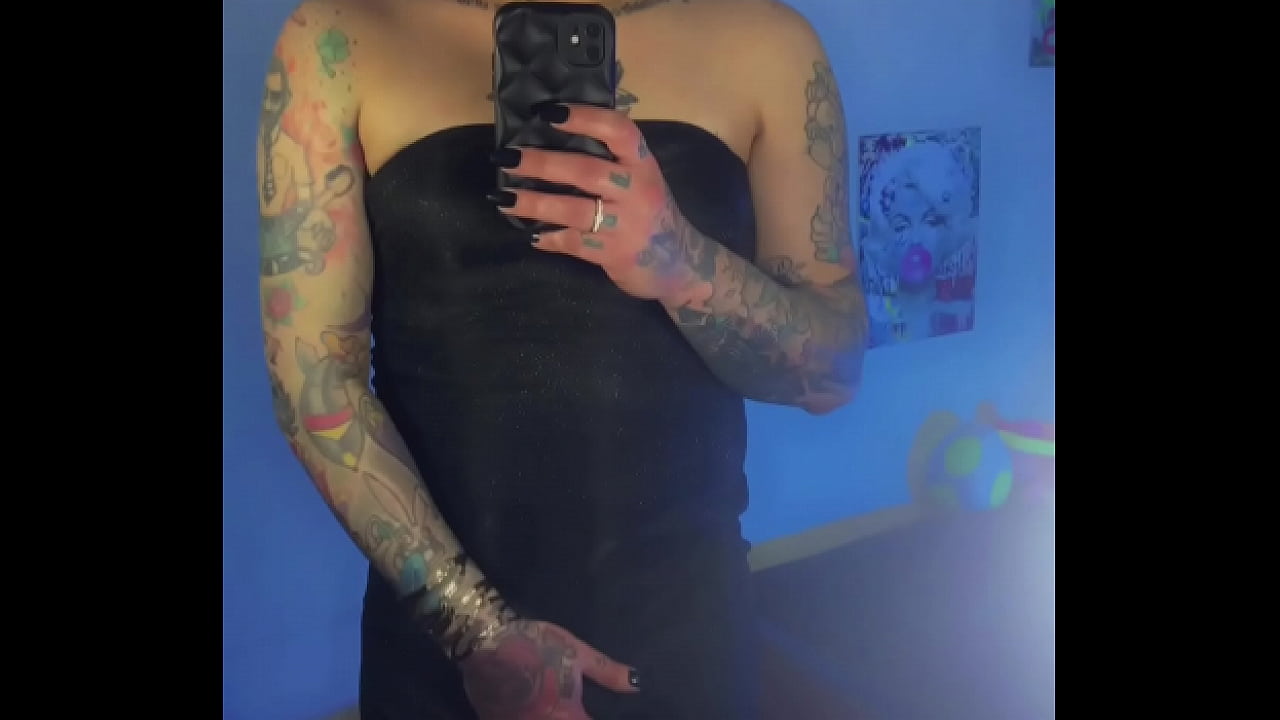 Trans girl Emma Ink shows off in the mirror in high heels and a short dress. Without panties his big dick was loose