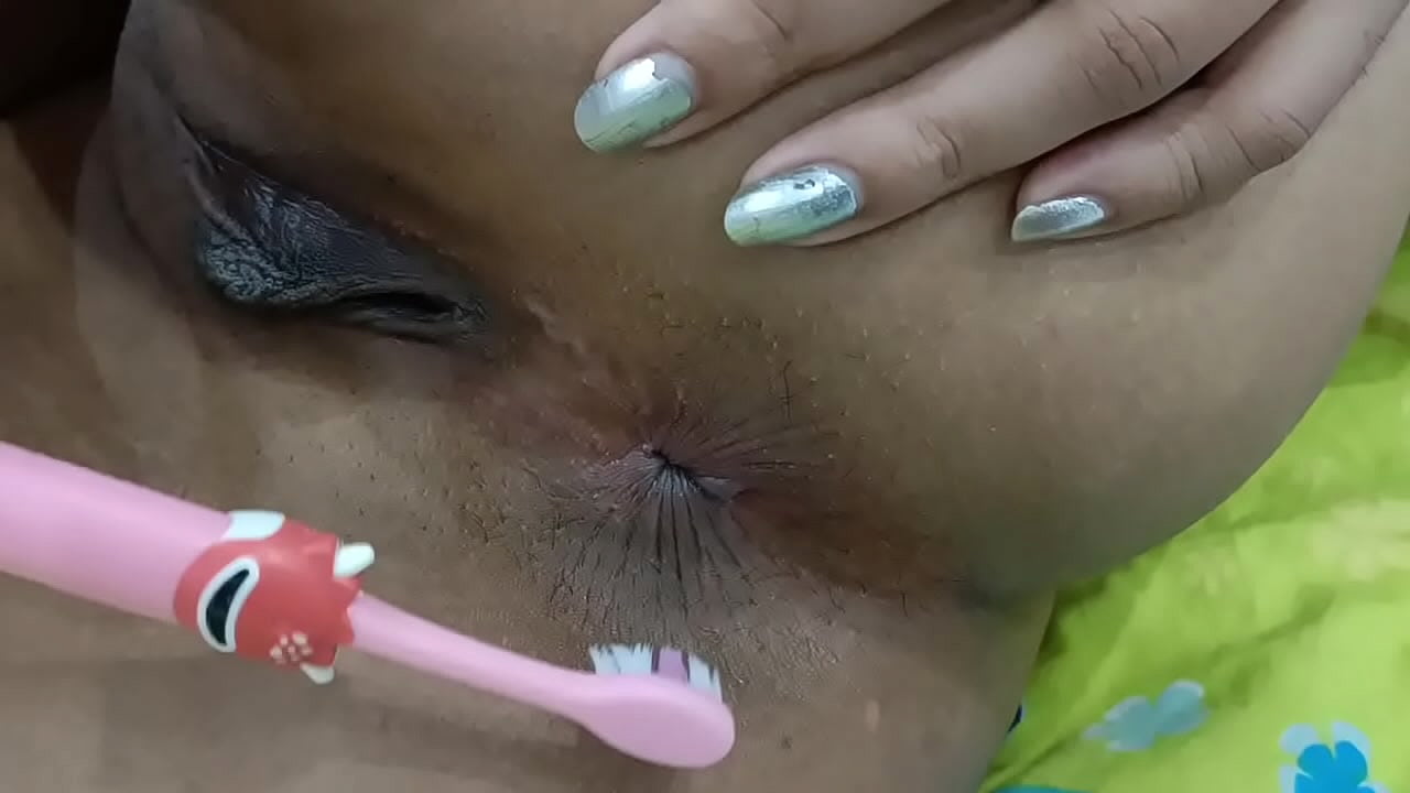 Desi Village Housewife inserting Teeth Brush in her Ass hole