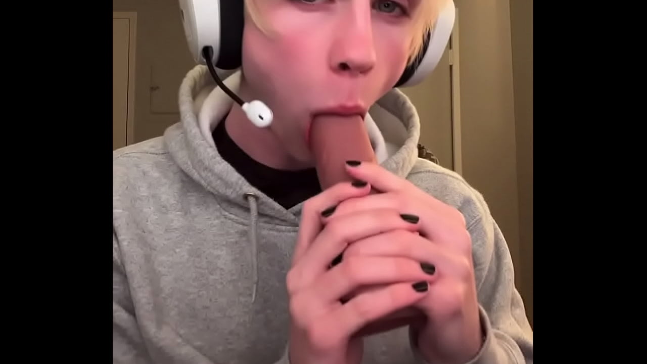 Blonde gamer boy and his toy