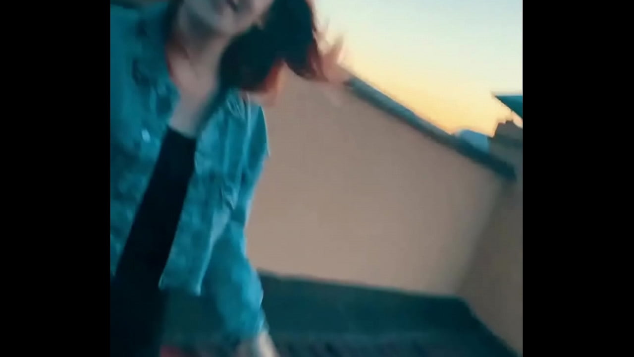 The redheaded beauty sucked a big cock in front of a beautiful view from the roof