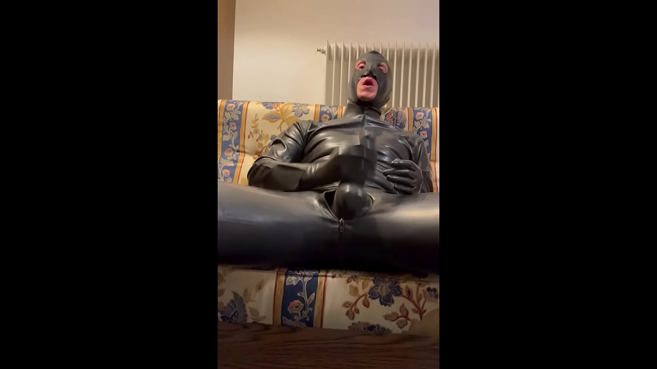 What a huge cock in latex and what a super cumshot