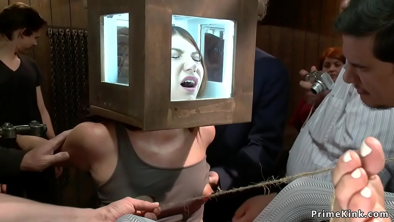 Redhead slave with head locked in glass box gets pussy fingered through hole in leggings then anal fucked and made rimming mistress