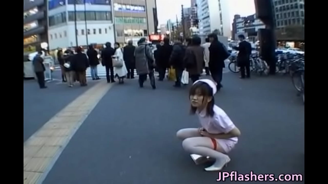 Naughty Asian girl is pissing in public