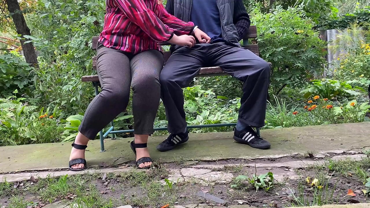 Milf had to sit on a bench to hold his cock while he pees