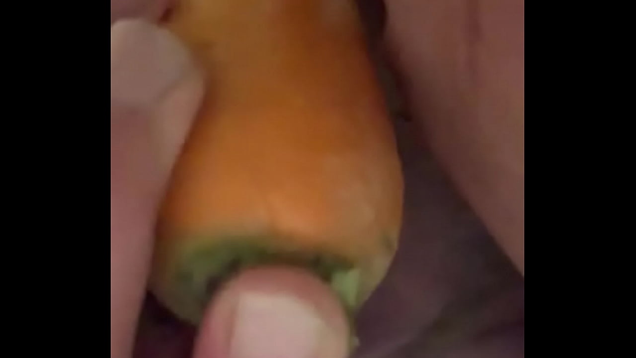 Tying to stick the whole carrot in