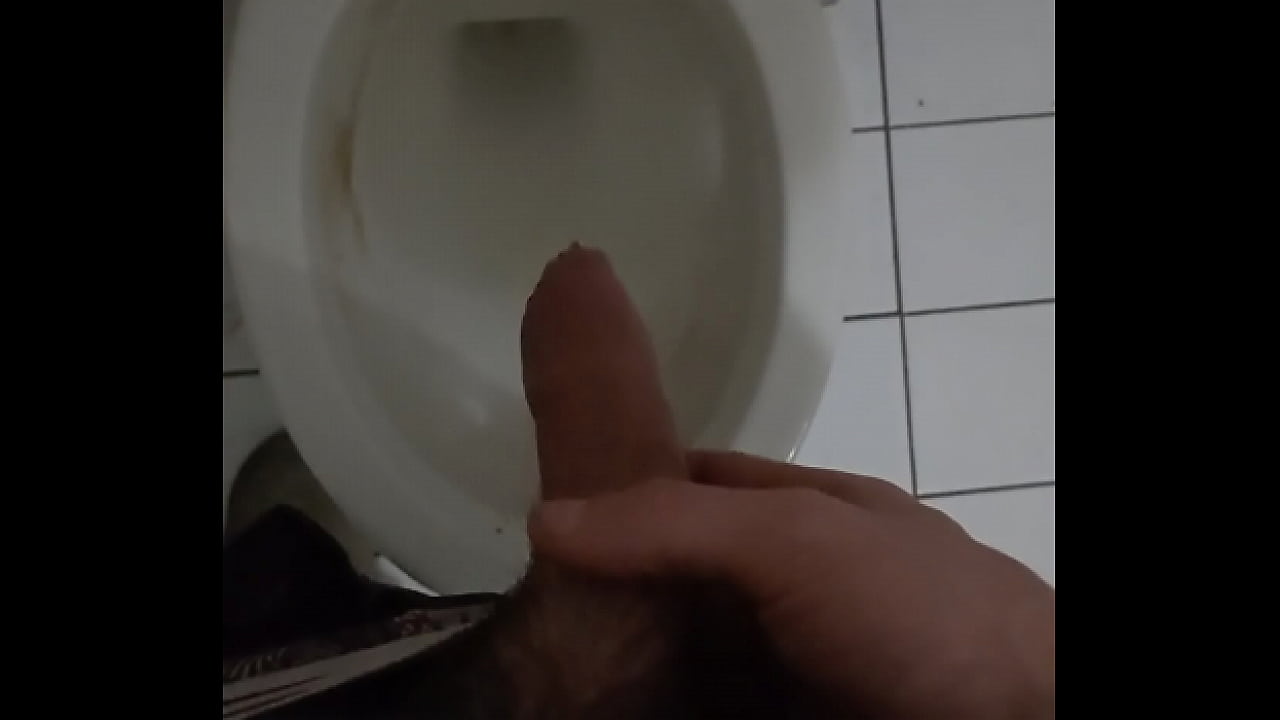 Boy taking a pee in toilet