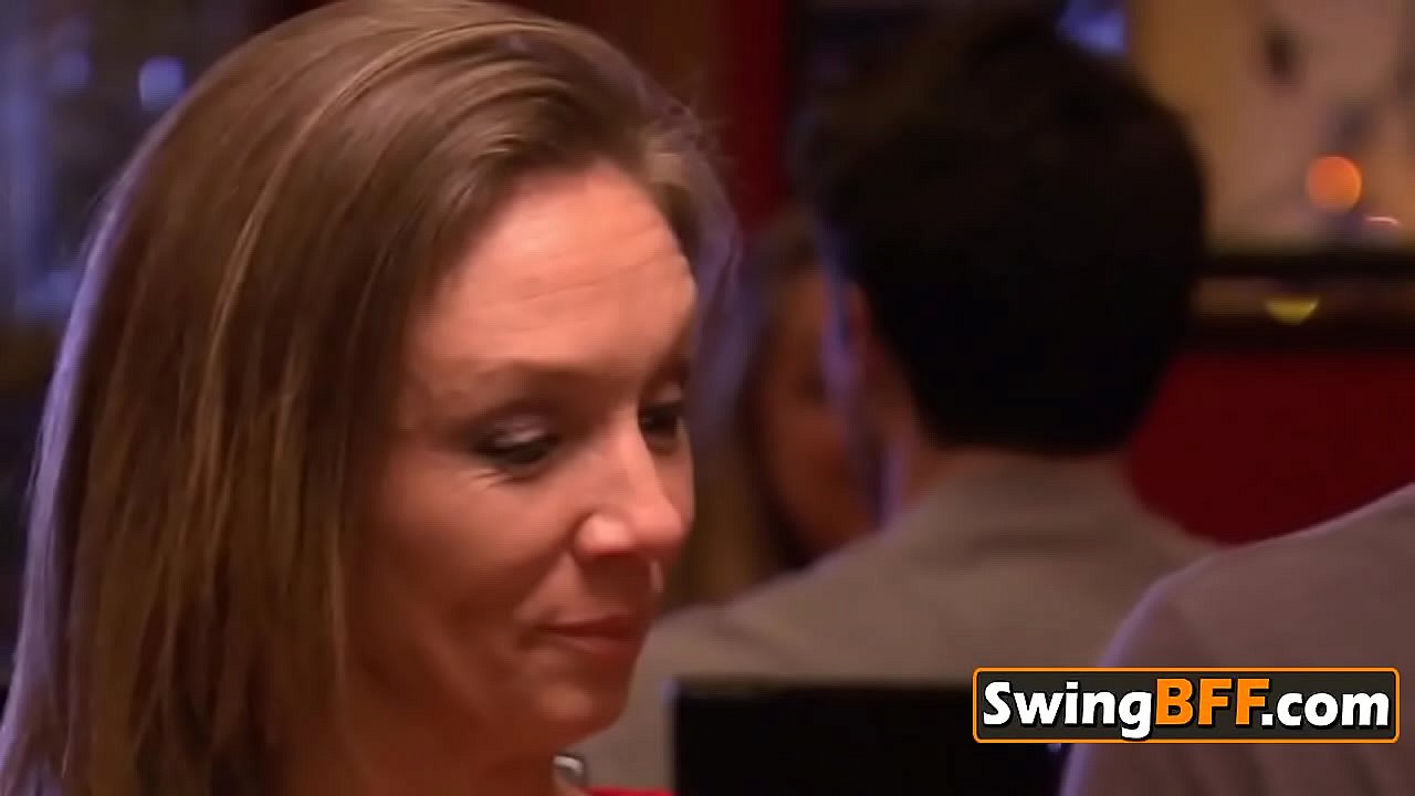 Swinger couple compliments each other