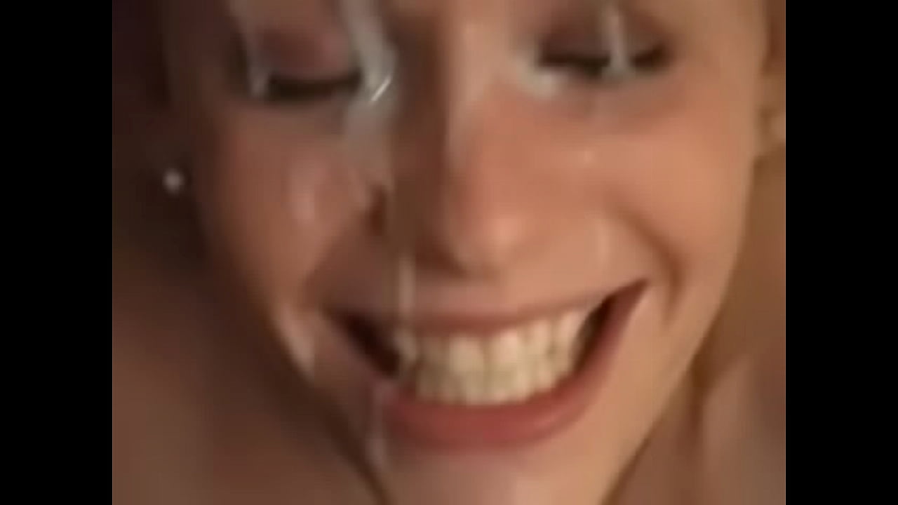 Painting her Face with Cum