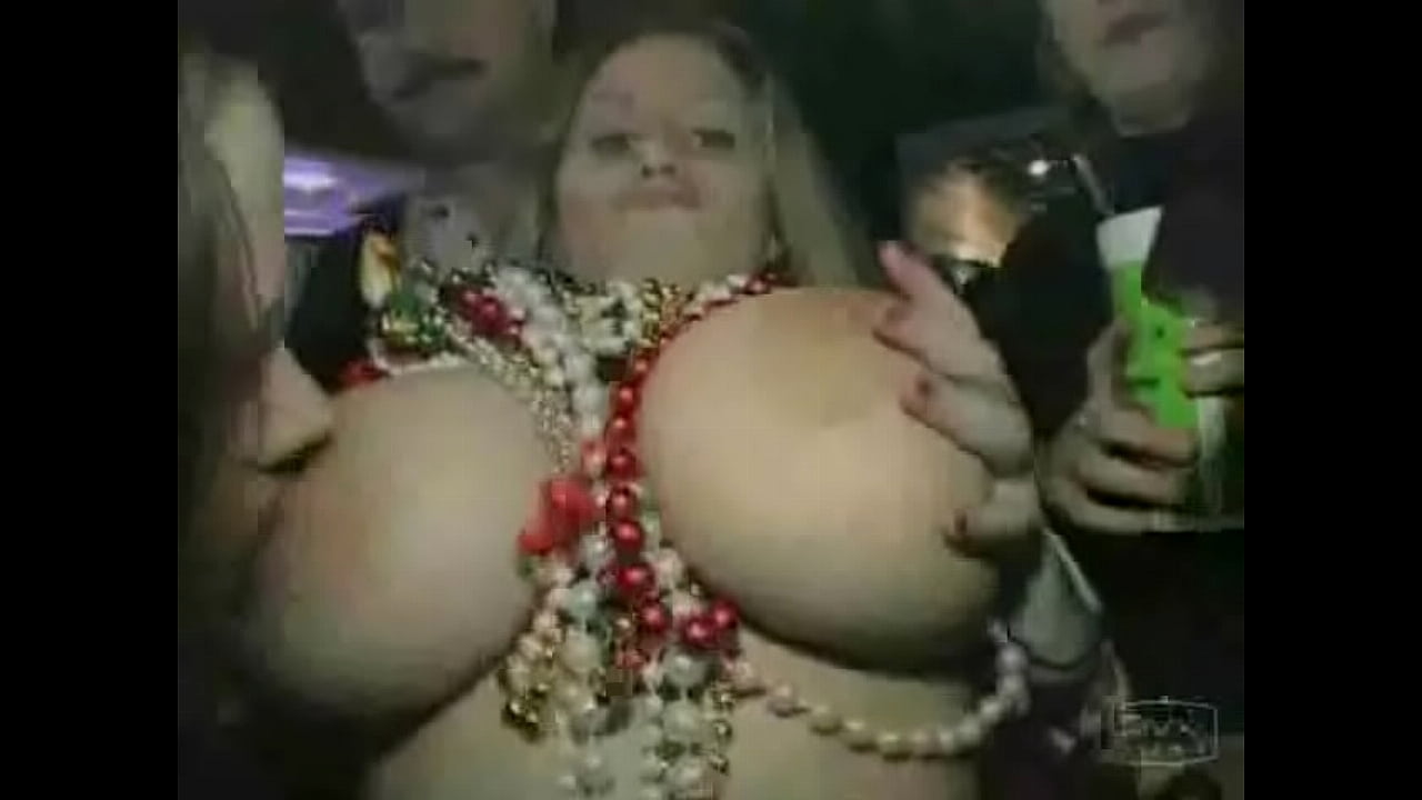 Busty girl shows boobs at Mardi Gras