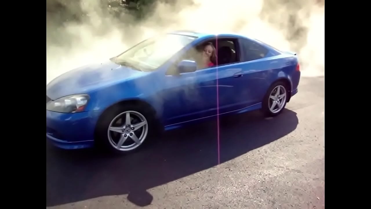 Young woman blows engine In Acura RSX twhile her two friends stand by and watch