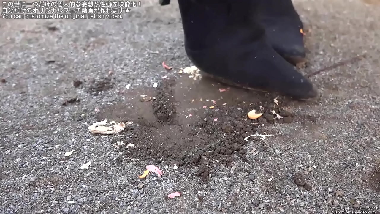 Woman trampling peanuts with legs