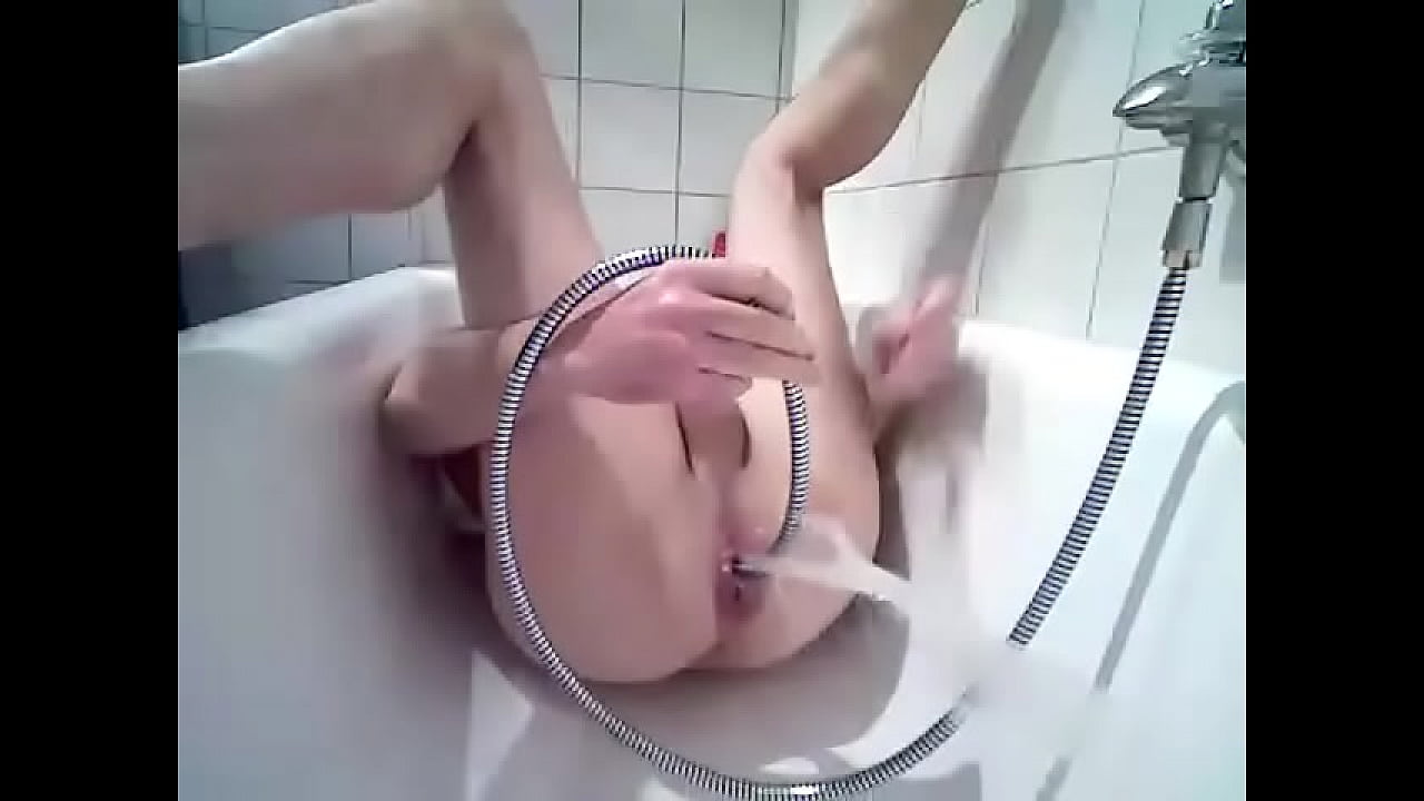 Enema, belly with anal water inflating under pressure