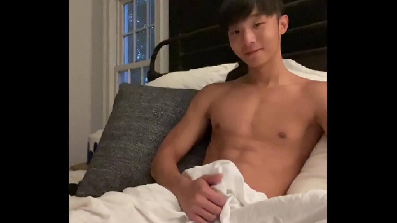 Asian boy stroking cock