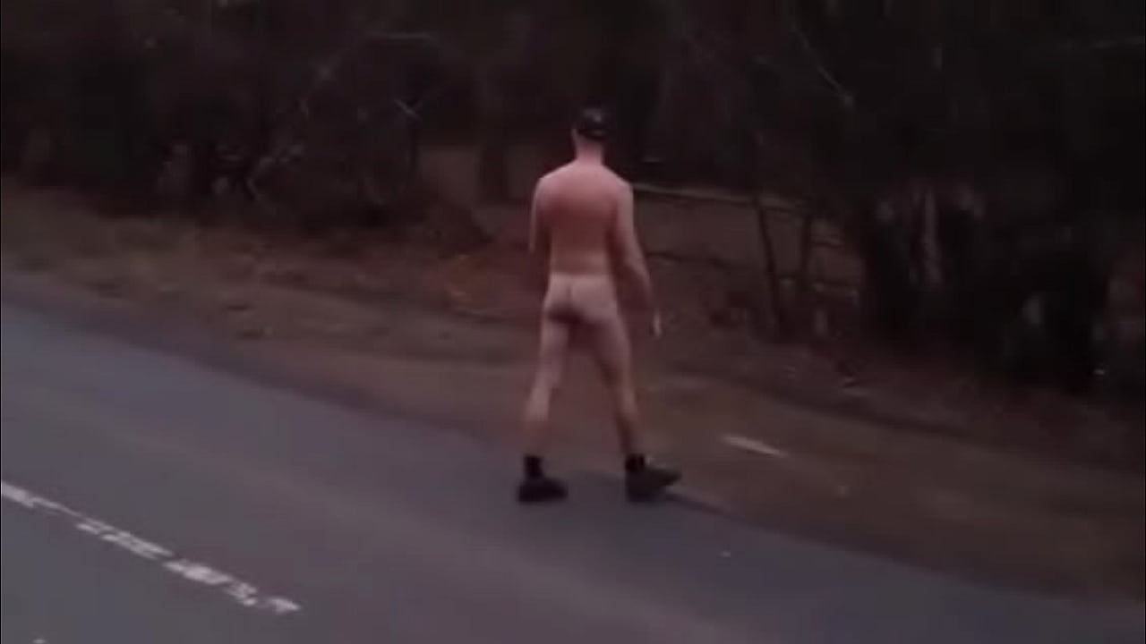 Naked dares on a road in full view of cars