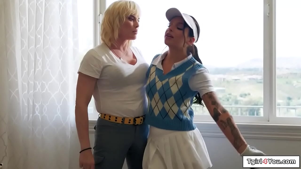 Shemale milf Lucy Hart teaches her tattooed gf to golf and gets horny.The brunette sucks her cock and rims the blonde tgirl.The big tits ts fucks her