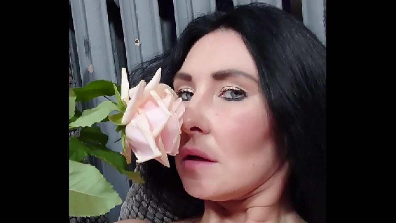 MILF enjoys the touches of a rose