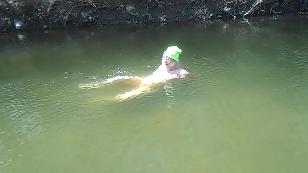 Skinnydipping Naked Driver gets out of the water