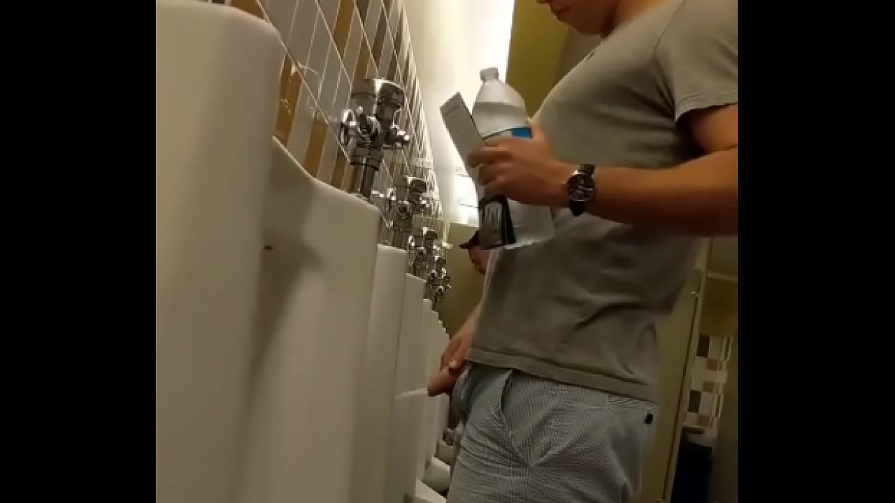 Guys pissing on toilet