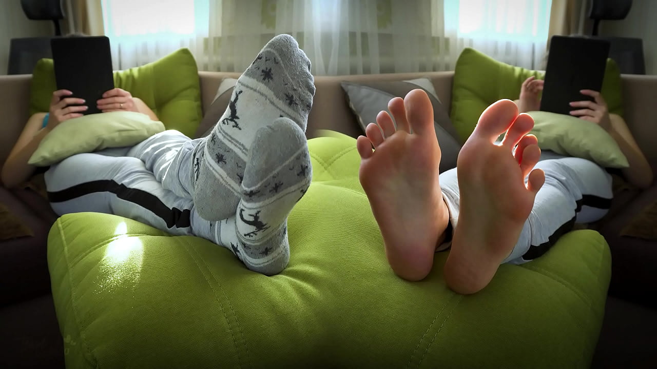 Girl In Worn White Socks Showing Off Her Bare Soles