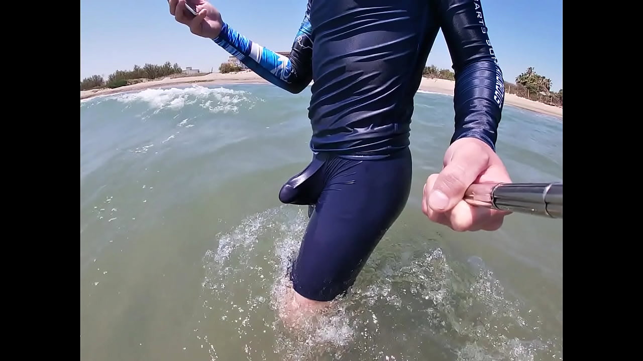 Surfer gets erect in his lycra for the pleasure of the people