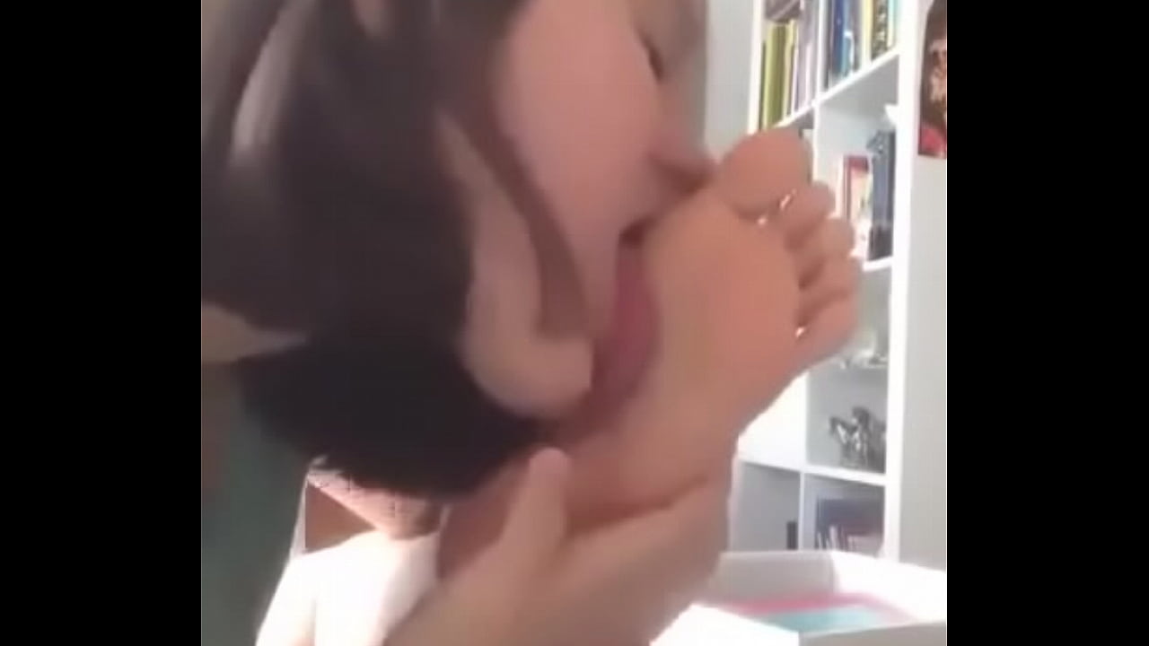 Girl licking her foot