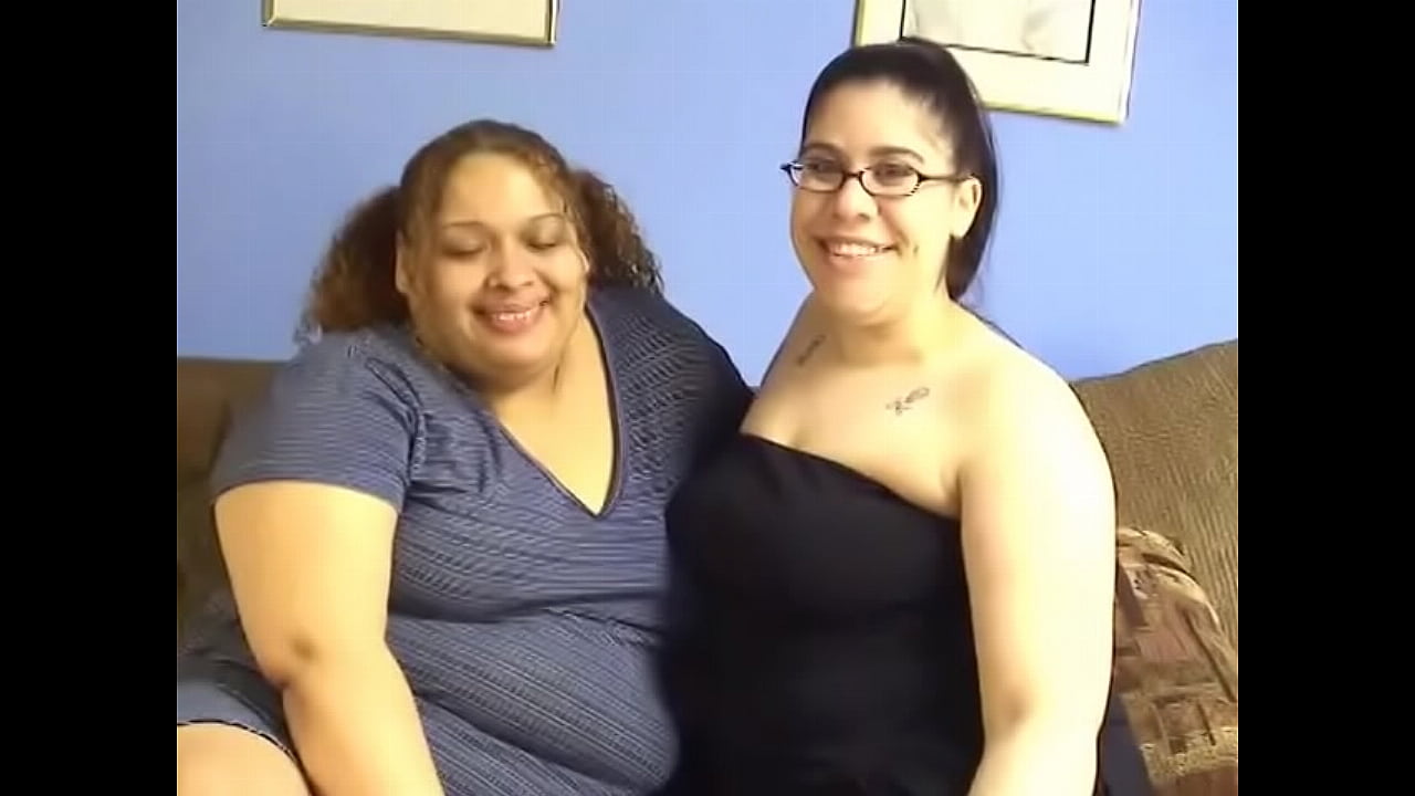 Two BBW lesbians Lulu Garcia and Nikki have fun with a strap on