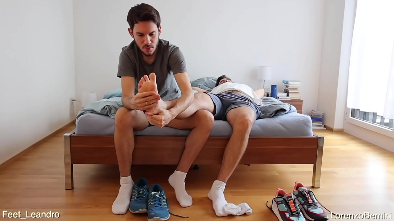 Gay friends playing with feet, socks and shoes