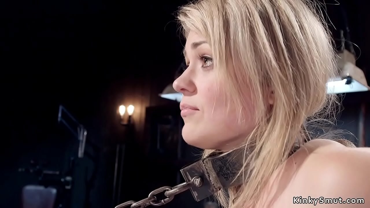 Natural busty gagged blonde slave in standing bondage gets nipple clamps and whip