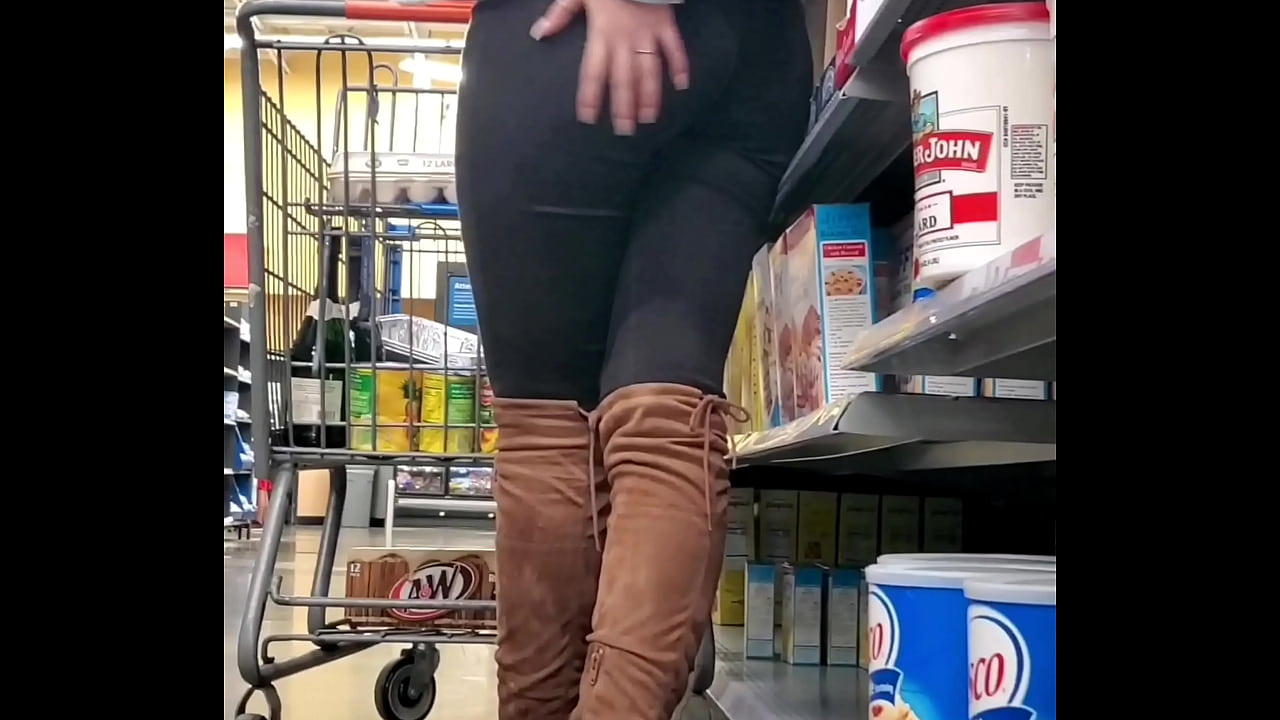 Sexy teen rubs her booty in store