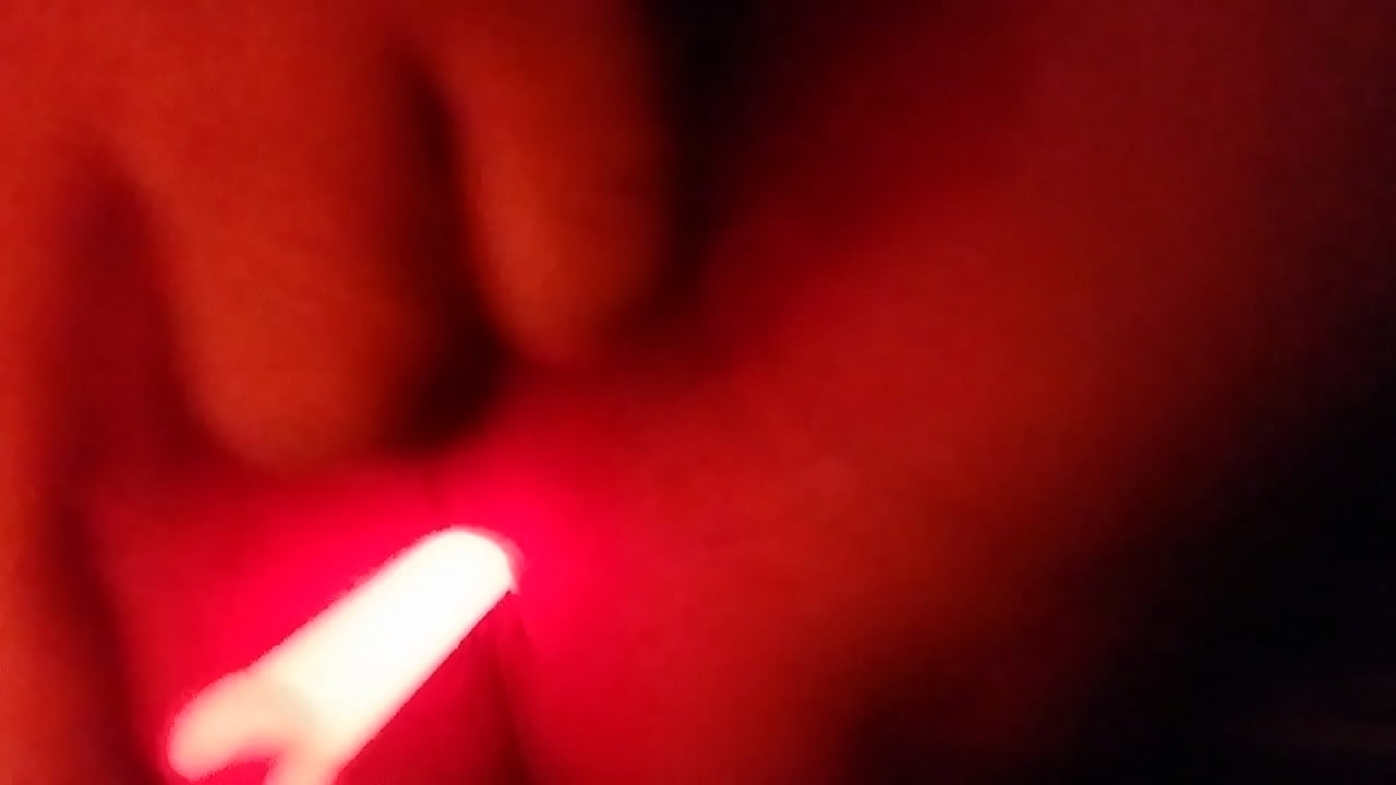 Anal masturbation with a light stick in the dark