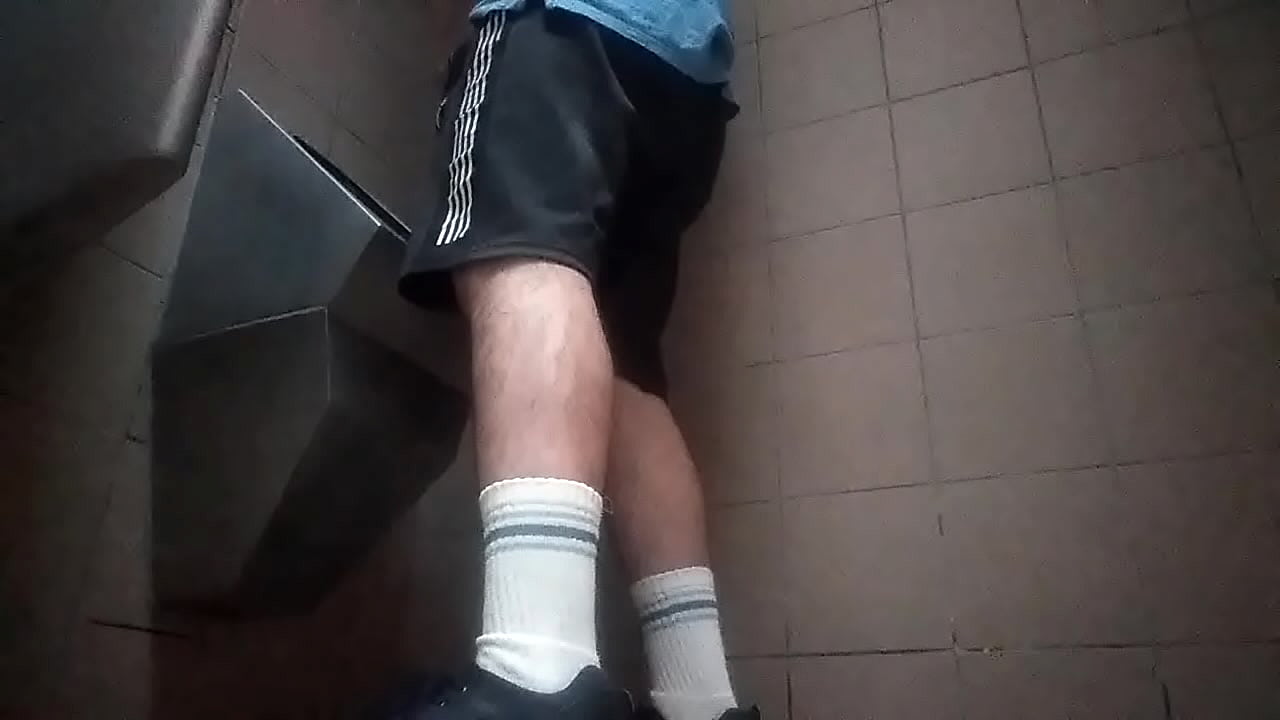 Gay guy peeing in socks and shorts