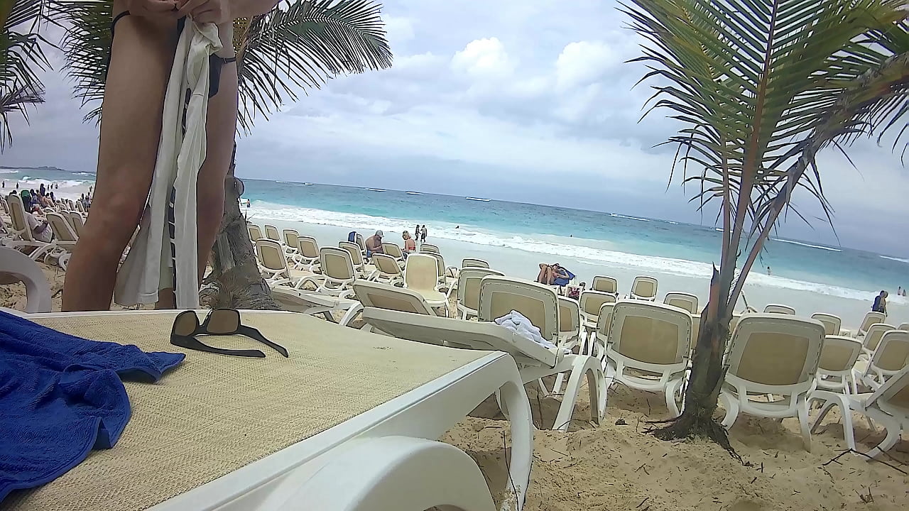 cock pops out on beach