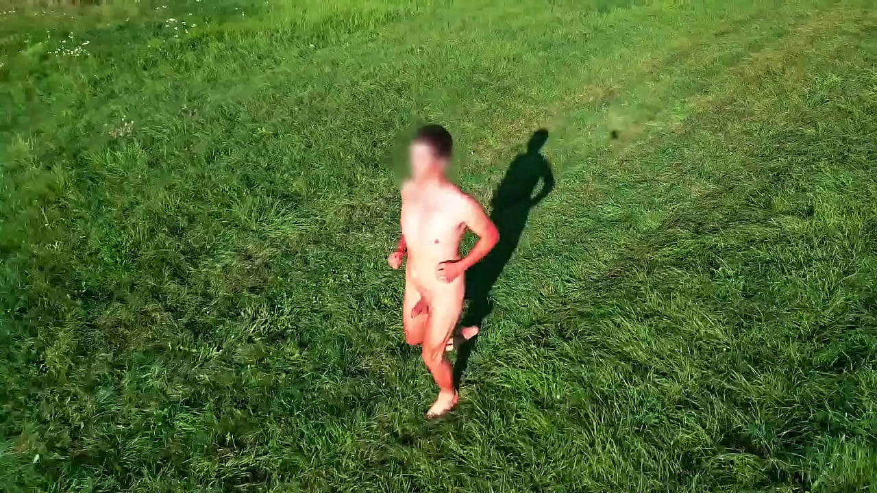 Naked guy in nature in drone view