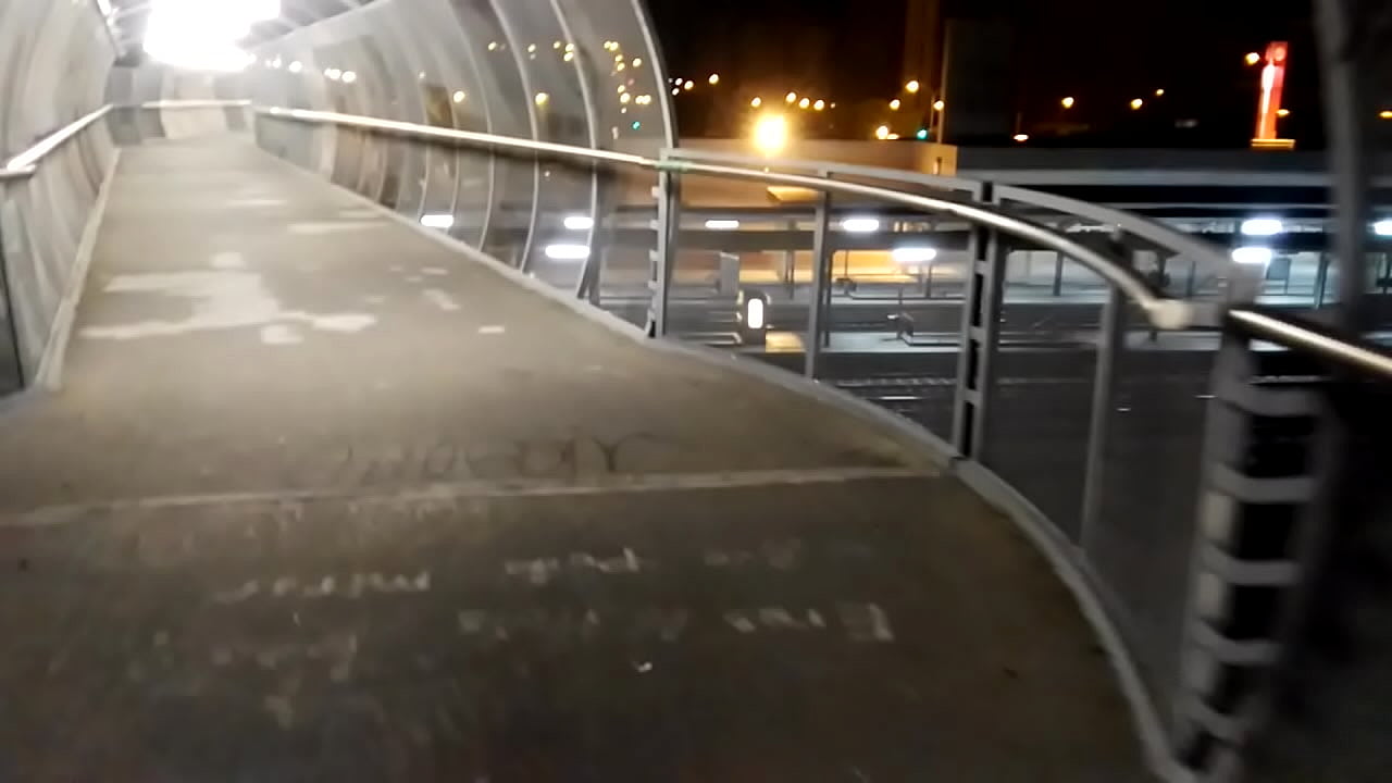 Naked on a bridge over the railway